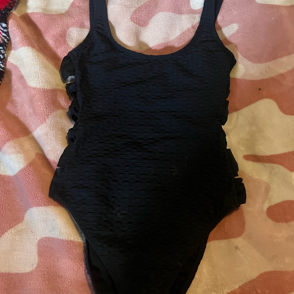 Size small one piece black bathing suit with cut out bows on both side